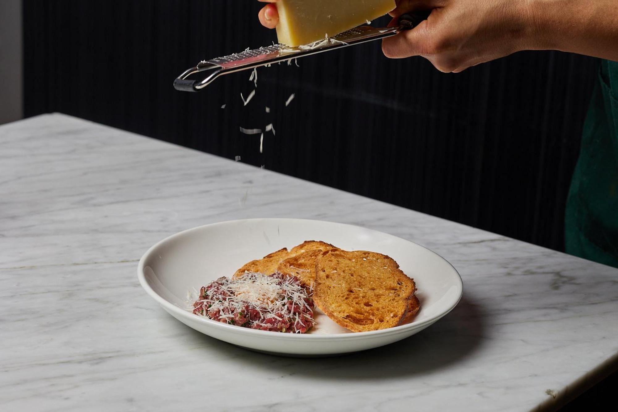 The Inchcolm By Ode Hotels Brisbane Exterior foto Parmigiano-Reggiano being grated over a dish of bread